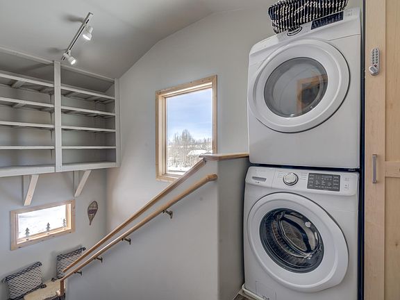 Landing to apartment. Full size washer and dryer