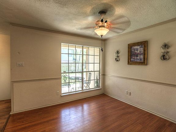 Formal dining has wood laminate flooring.
