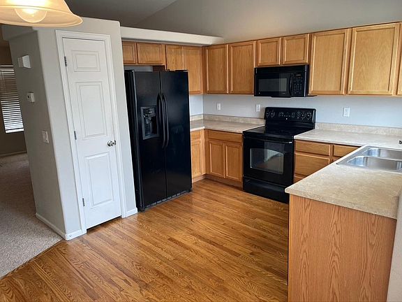 Spacious Kitchen with wood flooring