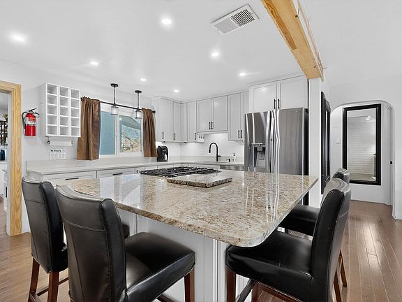 Open floor plan kitchen adjacent to front living room.