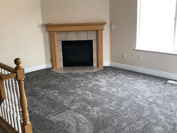 Gas fireplace and vaulted ceiling. Staircase to basement is straight across from front door.
