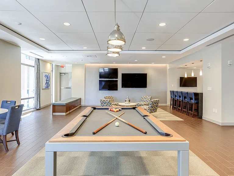 Sports Lounge media wall with 75a flat screen TV and complimentary Wi-Fi