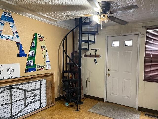 Enter Front Door and just to the right is a Spiral StairCase to the 2nd Floor Front BedRoom, but for now We'll continue thru the LivingRoom