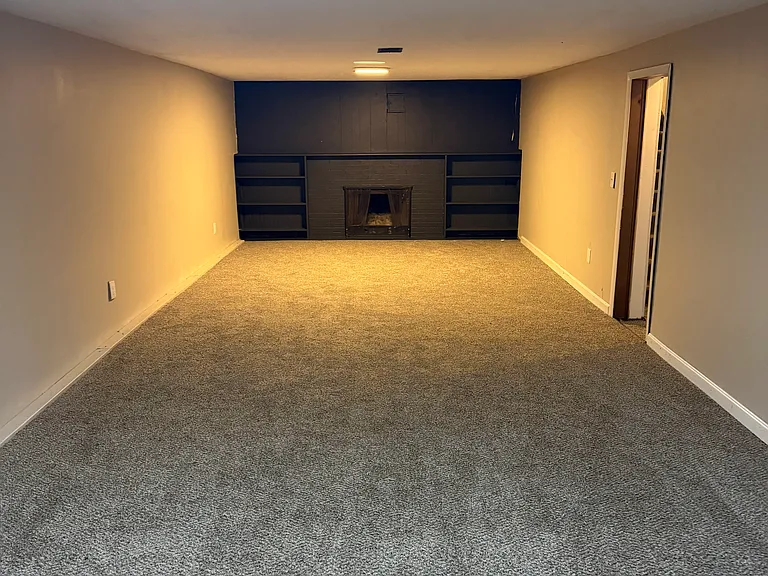 Very large rec room, 32 feet with fireplace with new carpet