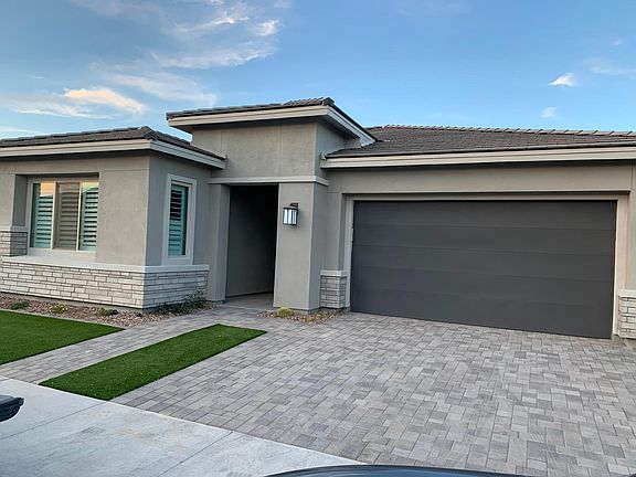 Landscaping coming soon, different from photo.