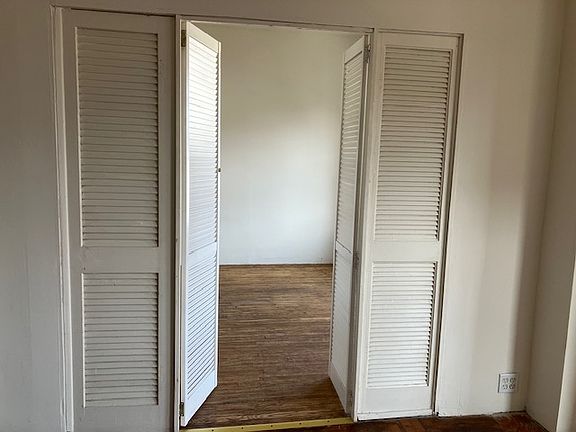 Louvered doors to the bedroom