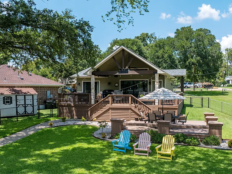 Backyard with covered patio and plenty of seating.