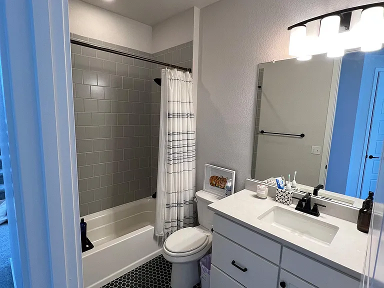 Full bathroom with tub upstairs for bedrooms 2-3.