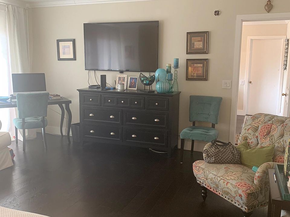 double sized bedroom has room for sofas and chairs, has slider to outside