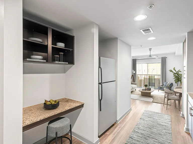 Explore this chic apartment with a seamless flow from kitchen to living room, perfect for entertaining at Cottonwood Westside Apartment in West Midtown Atlanta Explore this chic apartment with a seamless flow from kitchen to living room, perfect for enter