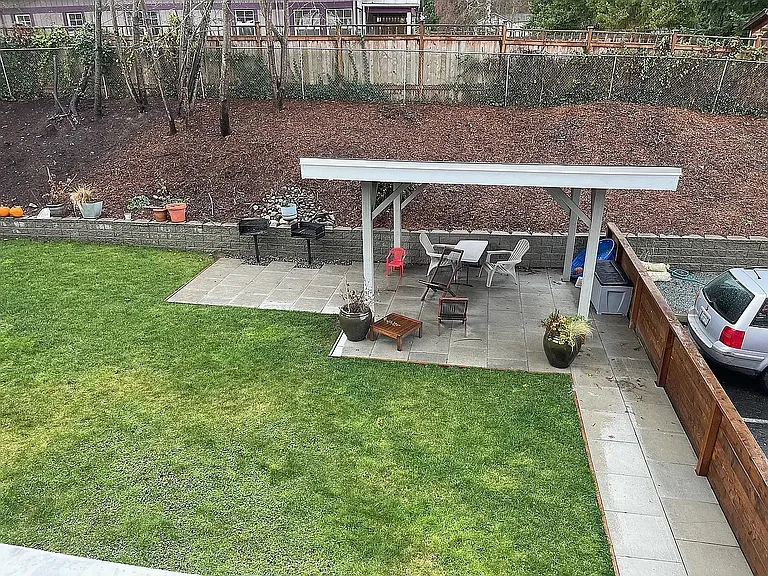 Normandy 8 courtyard for relacing outdoors. Covered gazibo with bbqs to the left.