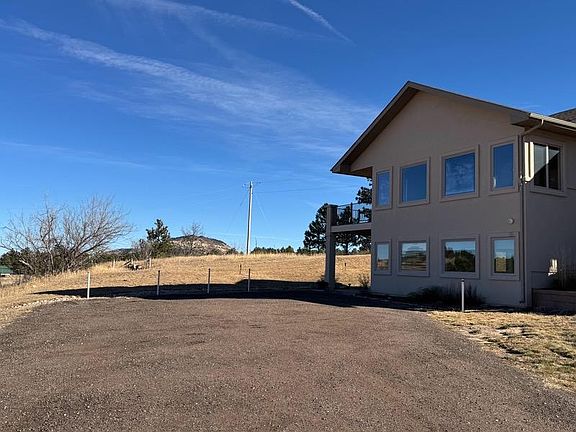 Parking area and carport/patio.