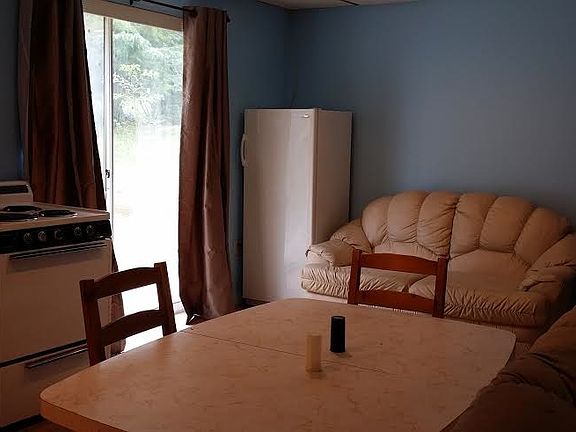 Kitchen area w/ entry door