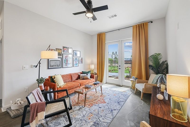 The Ashworth: Spacious Living Room with Concrete Floors*