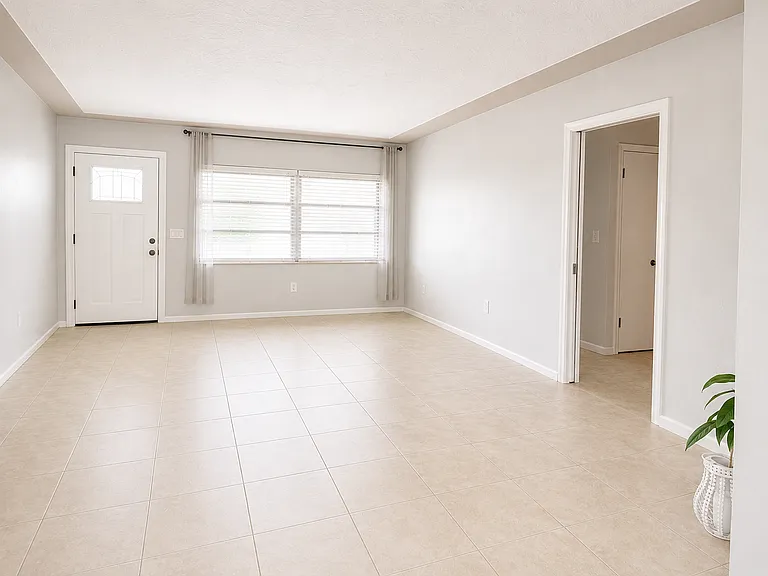 Front Living Room with a look into hallway to two bedrooms and one bathroom.