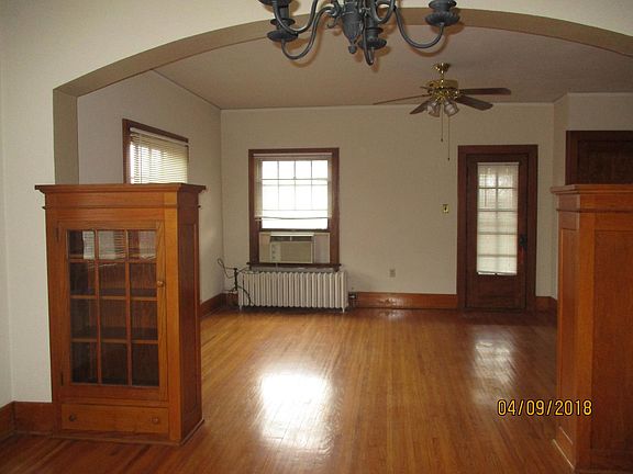 Bookcases on each side, door to deck.
