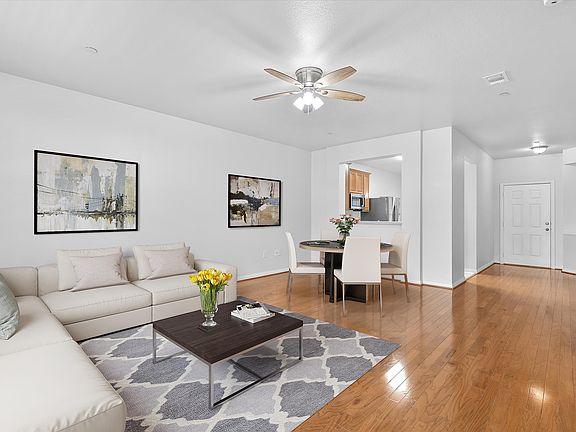 Living and dining room staged to show potential