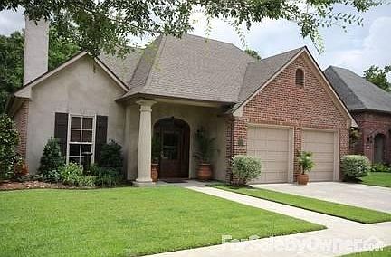 203 Briarbend Drive
						:
						Manicured lawn and landscaping gives this brick & stucco home great curb appeal