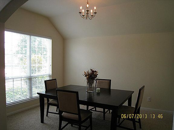 Formal Dining is just off entry and looks to front of home with a connection to kitchen