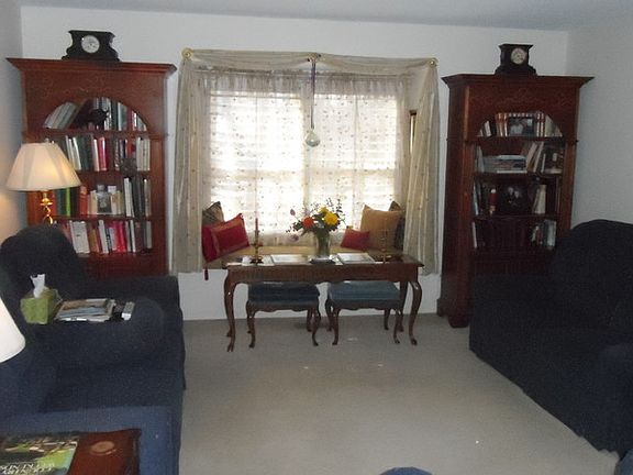 Living Room with window seat, fireplace
						:
						Living Room with built in fireplace that is off to the right on an angled wall.