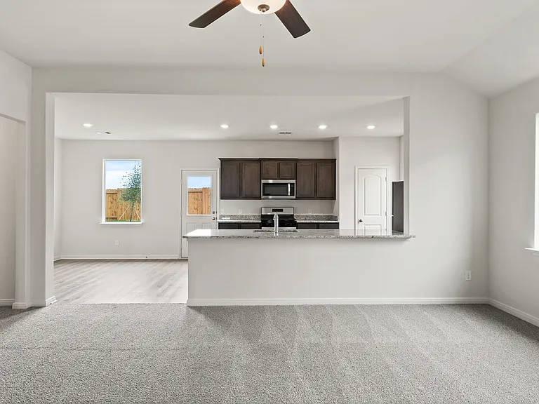 The open layout connects the family room with the kitchen and dining room.