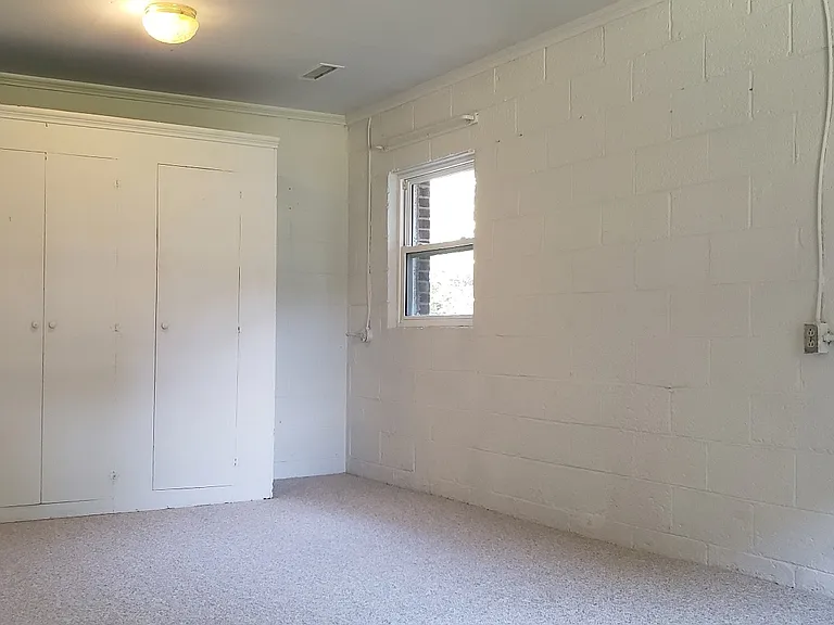 A full wall of closets in the bedroom