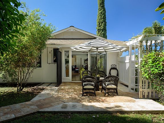 Private patio and fenced yard off living room. Outdoor shower