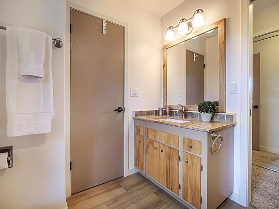 Bathroom with 2 entry's one from hallway and one from primary bedroom.