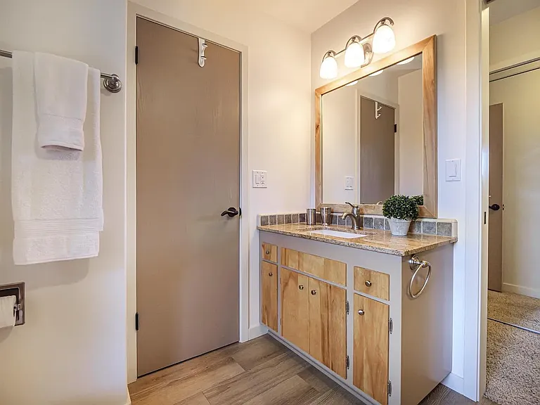 Bathroom with 2 entry's one from hallway and one from primary bedroom.