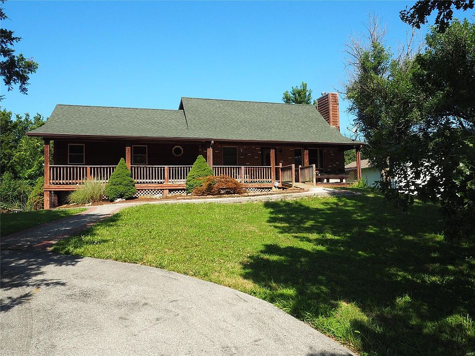 Welcome to 10167 Sandy Church. The huge and welcoming full-length covered porch and 3-car garage are just the beginning of the a