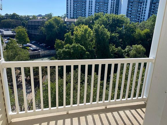 Patio overlooking walking path and pond