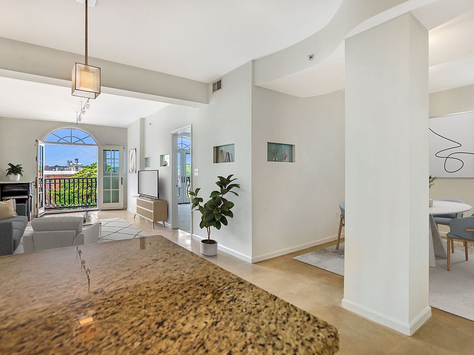 Living and dining area (virtually staged)