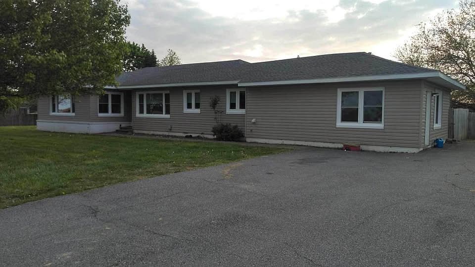 Front of home with paved driveway