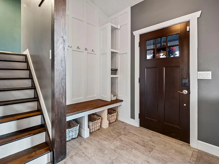 Feel welcomed by the drop zone, perfect for all of your coats, shoes, and other belongings.