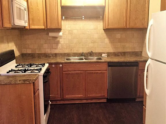 Kitchen with gas range, refrigeratorm microwave and dishwasher