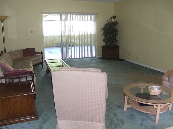 Good size living room. Carpet is off taupe in this room now.