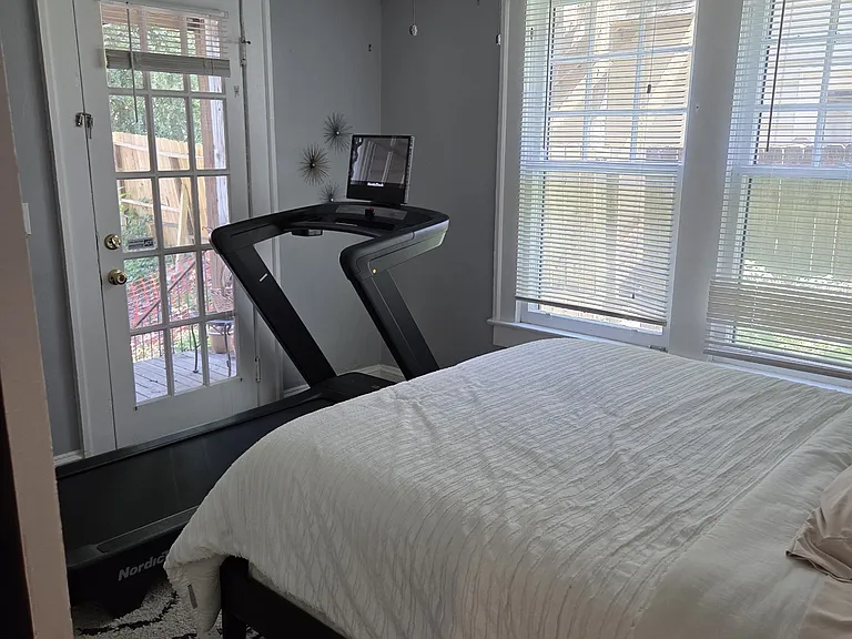 second bedroom with view of second covered deck