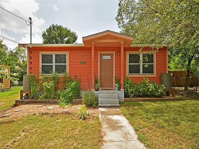 Vibrant color, rain barrel collection system and native plantings. Great curb appeal!