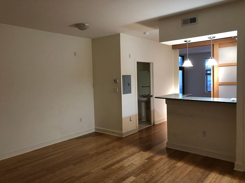 Living room, kitchen, door to bedroom