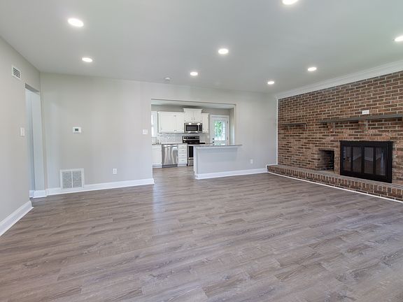 Great Room with Brick Fireplace Accent Wall