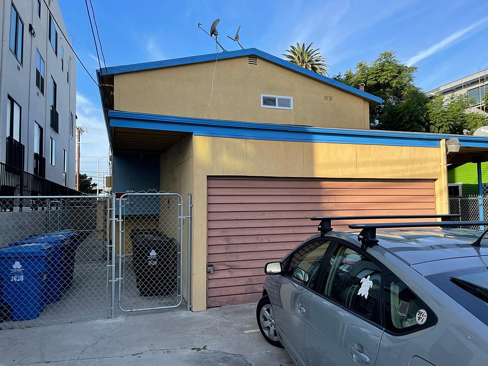 Rear of complex with parking space for this unit