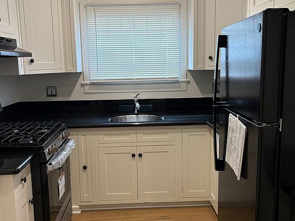 Chef's kitchen with black granite countertop, LOTS of storage and all brand new appliances