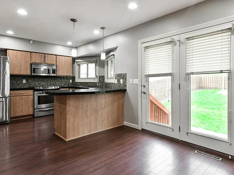 Kitchen with WalkOut to Patio in Back Yard