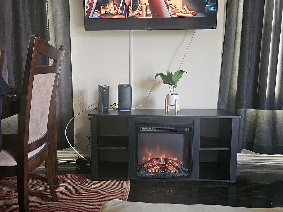 Living room, 55" TV, internet, cable & fireplace. New sound proof windows throughout unit!