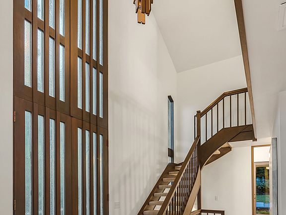The cathedral ceilings throughout and the two-story entry hall provide a spacious feel and unique ambiance.
