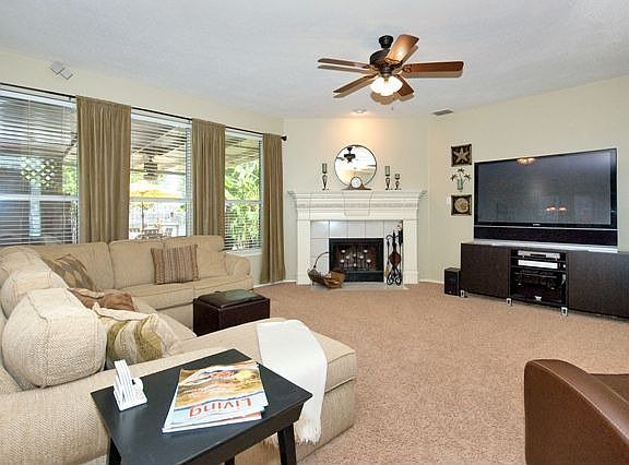 Spacious Living Area With Nice Fireplace Mantle. 