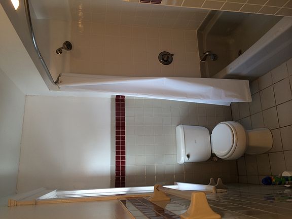 Newly tiled tub surround with new fixtures