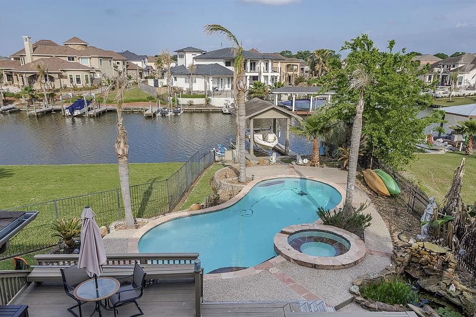 Look at this gorgeous water front view!! Relax in the pool or go out on your boat or jet ski.