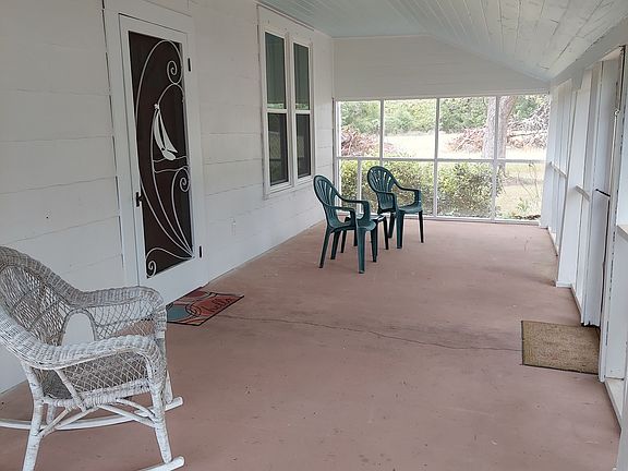 covered front porch with ramp and screened porch perfect for morning coffee