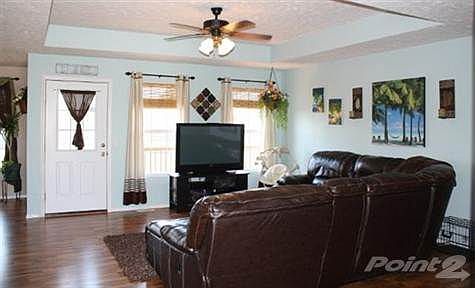 Large living room, perfect for entertaining. Upgraded laminate floor eliminates the worry of scratching!